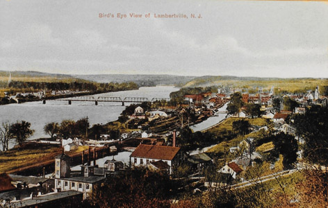 This bird’s eye view of Lambertville taken after 1904 illustrates the importance of the Feeder Canal to the city, as well as its relationship to the Delaware River.  Water power was supplied from the canal to the many mills and factories clustered along the waterway.  The basin below the Lambertville Lock provided the necessary clearance for canalboats to rotate 90 degrees in order to enter and exit the outlet lock to the Delaware River.